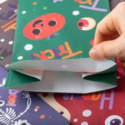 72pcs Halloween Candy Paper Bags -Spirit Halloween Shop 9 Design Trick or Treat Bags 72 Pcs 7 600x600 1